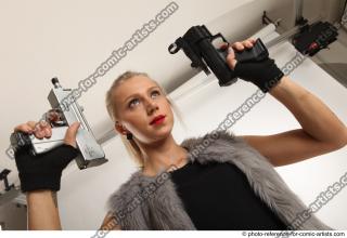 NIKOL STANDING POSE WITH TWO GUNS
